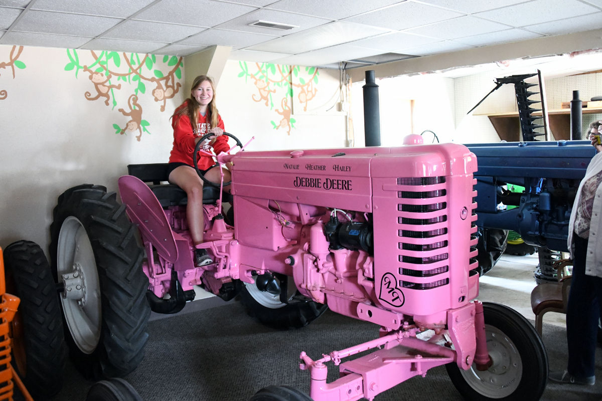 023 Sydney Dyer on a pink John Deere tractor.JPG